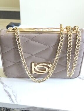 Bebe Taupe Crossbody With Gold Hardware.